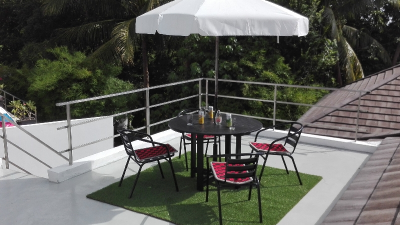 Villa PARIS, Terrace 2 upstairs with garden furniture, parasol, and view of the plain and the sea in the distance